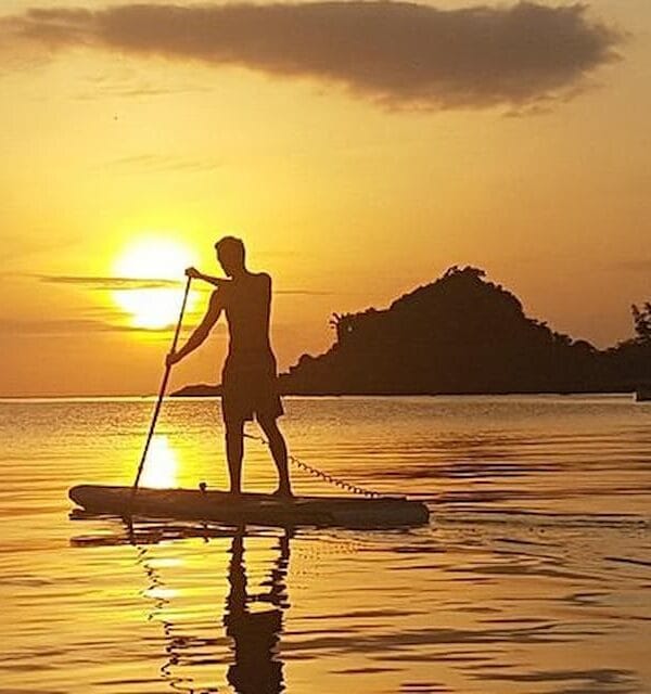Standup paddleboarding in Luwuk Banggai islands of Sulawesi during sunset