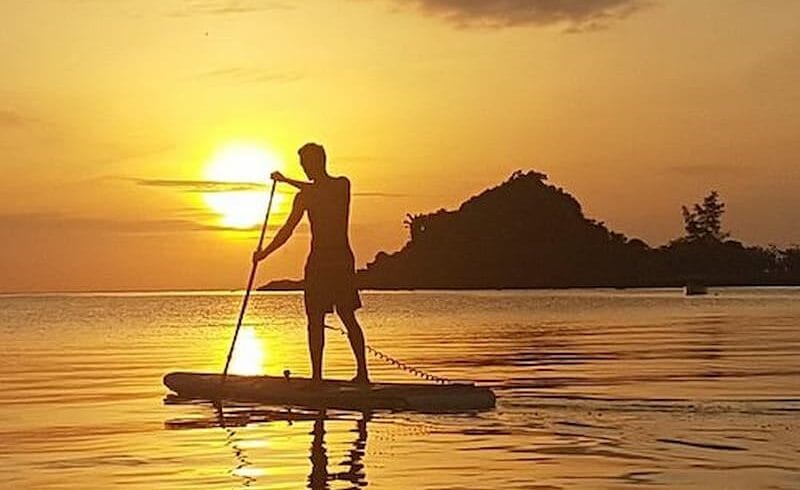 Standup paddleboarding in Luwuk Banggai islands of Sulawesi during sunset