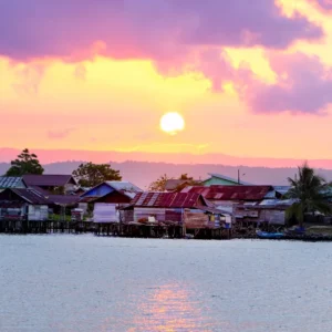 Sunset over a stilt village built on the water near Luwuk, Central Sulawesi