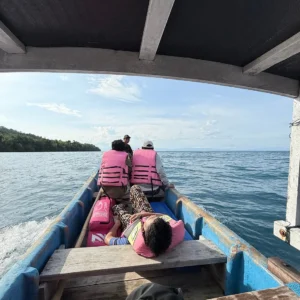 Passengers in life jackets aboard the wooden passenger ferry crossing from Luwuk to the Banggai Islands, Central Sulawesi