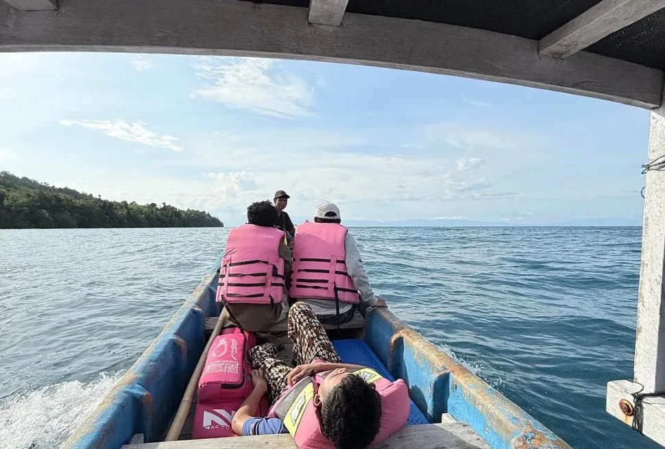 Passengers in life jackets aboard the wooden passenger ferry crossing from Luwuk to the Banggai Islands, Central Sulawesi