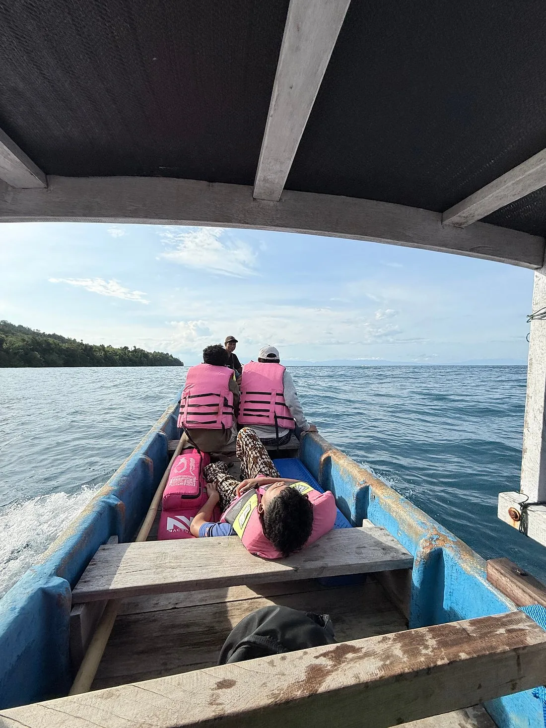 Passengers in life jackets aboard the wooden passenger ferry crossing from Luwuk to the Banggai Islands, Central Sulawesi